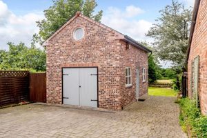 Ralph reviews a period property with shop in tarporley garage 