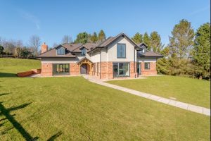 Ralph reviews a detached new build house in Kelsall front view 