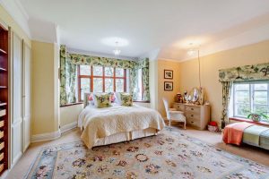 master bedroom with bay window in an Edwardian detached hoyuse for sale with Rickitt Partnership estate agency