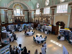 attendees speak to estate agents at the London and Country Property Show 2023