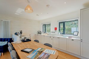 the kitchen dining area in a holiday cottage for sale in North Wales with Rickitt Partnership