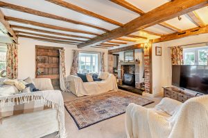 beamed sitting room in a cottage for sale near Whitchurch
