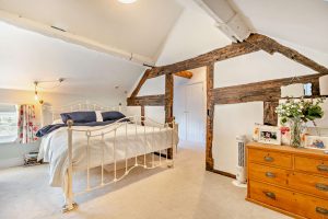 bedroom and en suite dressing room in a period cottage for sale in Whixall