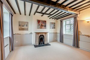 drawing room with beams and period features in  house for sale in Malpas