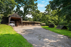stables, land, and brick garage with planning permission to convert to bungalow included with detached house for sale in Tilston