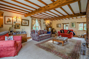 beamed sitting room in a former mill house for sale in Cheshire