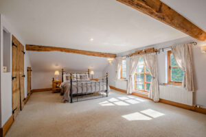 character bedrooms and bathroom in a converted mill house for sale with Rickitt Partnership estate agent
