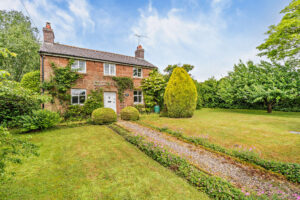a detached farmhouse for sale in Churton