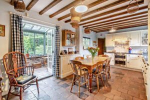 the kitchen and conservatory at a period farmhouse for sale with Rickitt Partnership estate agency