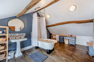 character bedrooms and bathroom with exposed timbers in house for sale in Holt